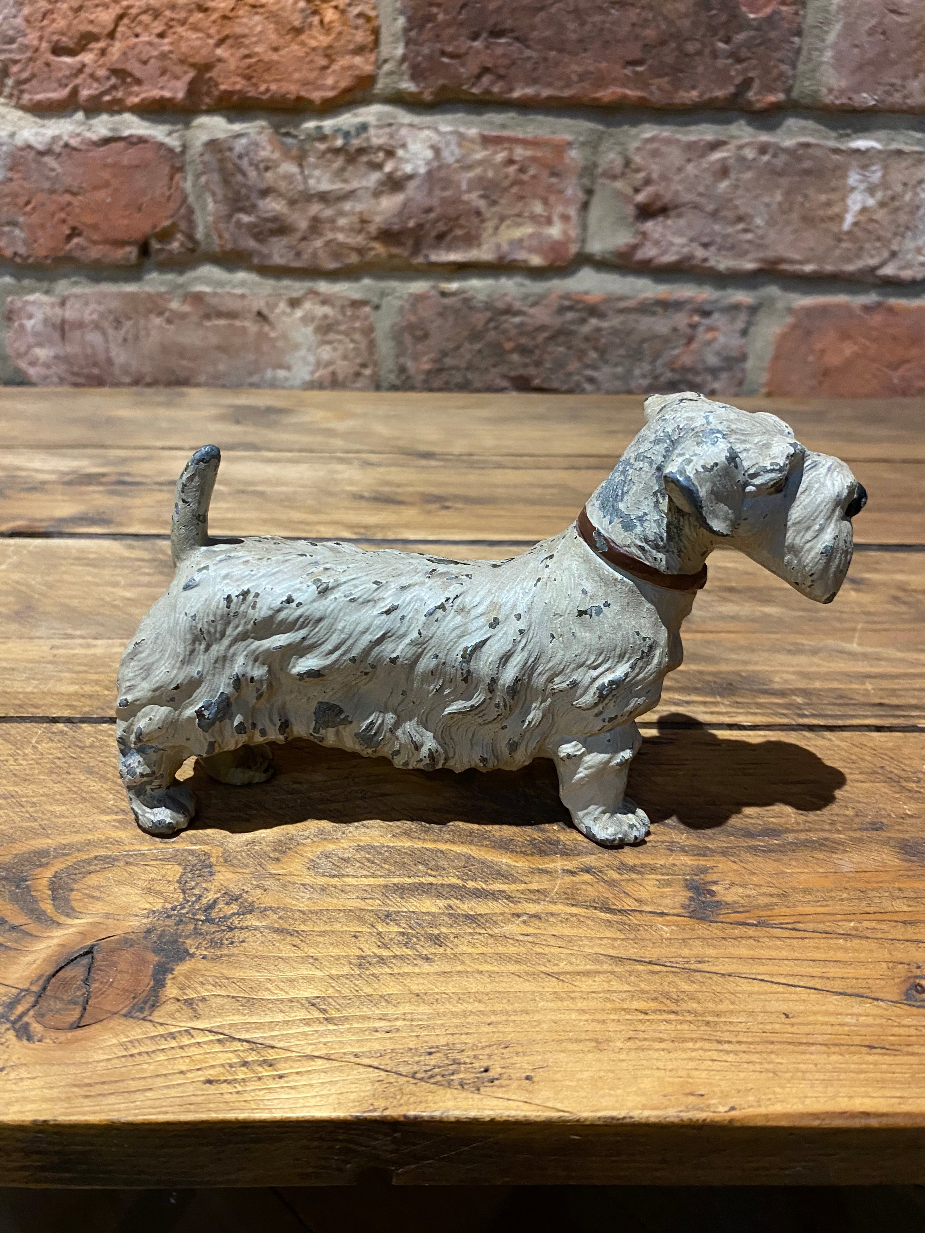 A vintage white dog ornament to add style and flair to your home decor