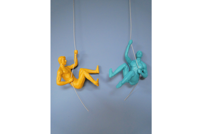 Raise your decor game with these two Abseiling Men Ornaments – these statement piece ornaments exude fun and flair.
